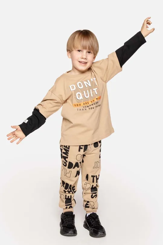 бежевий Дитячі бавовняні штани Coccodrillo Для хлопчиків