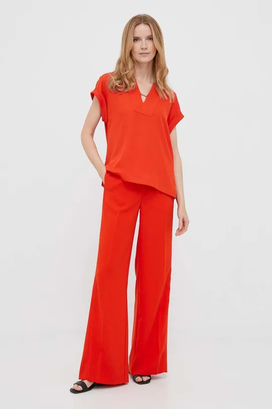 Nohavice Calvin Klein oranžová