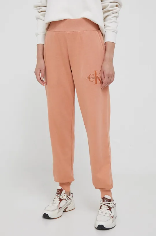 pomarańczowy Calvin Klein Jeans spodnie dresowe bawełniane Damski