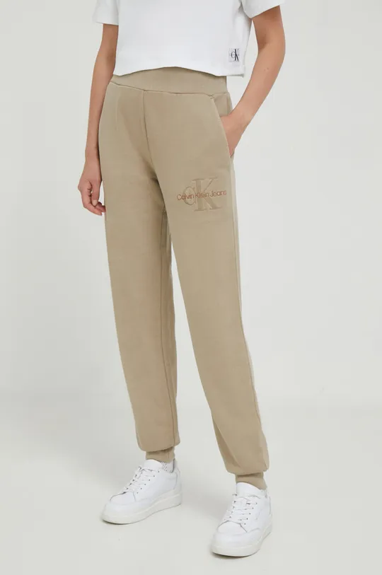 beżowy Calvin Klein Jeans spodnie dresowe bawełniane Damski
