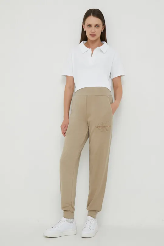 Calvin Klein Jeans spodnie dresowe bawełniane beżowy