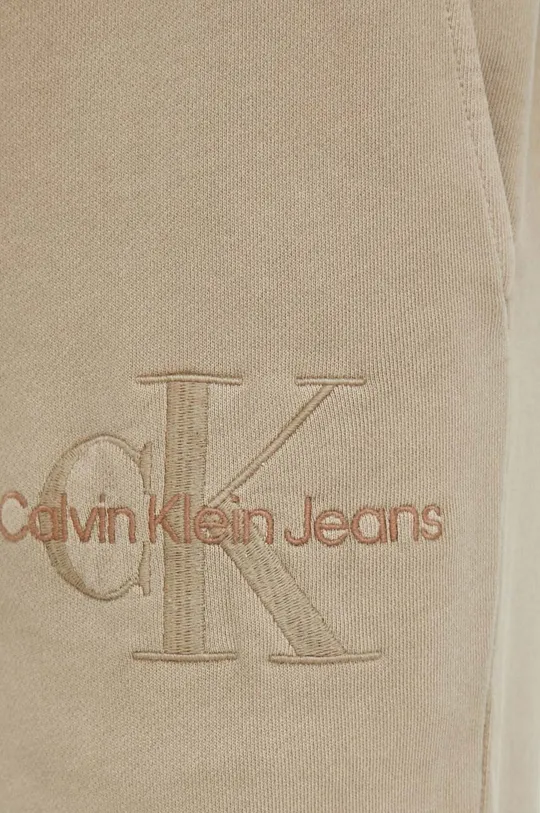 бежевий Бавовняні спортивні штани Calvin Klein Jeans