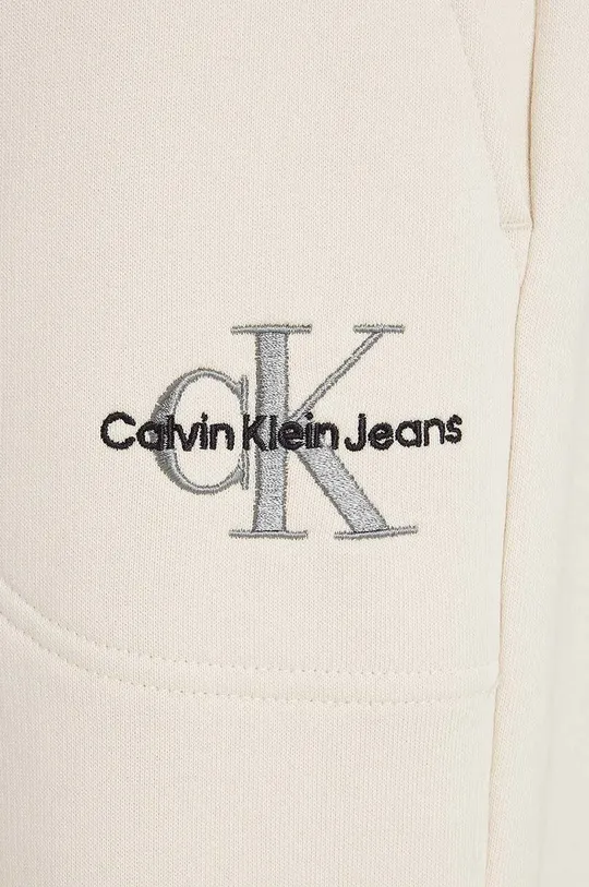 beżowy Calvin Klein Jeans spodnie dresowe dziecięce