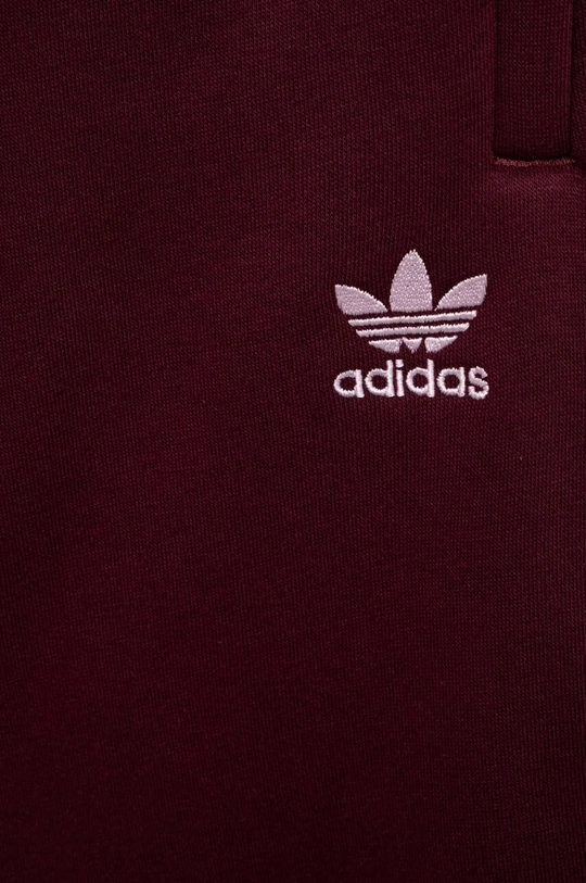 Otroški spodnji del trenirke adidas Originals  Glavni material: 70 % Bombaž, 30 % Poliester Podloga žepa: 100 % Bombaž