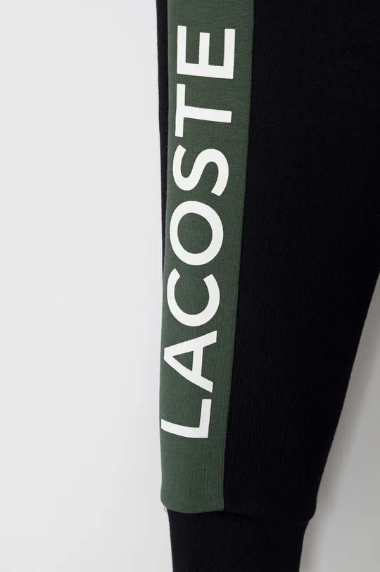 Дитячі спортивні штани Lacoste Основний матеріал: 69% Бавовна, 31% Поліестер Резинка: 97% Бавовна, 3% Еластан