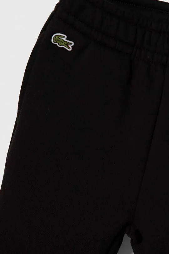 Детские спортивные штаны Lacoste Основной материал: 69% Хлопок, 31% Полиэстер Подкладка кармана: 100% Хлопок