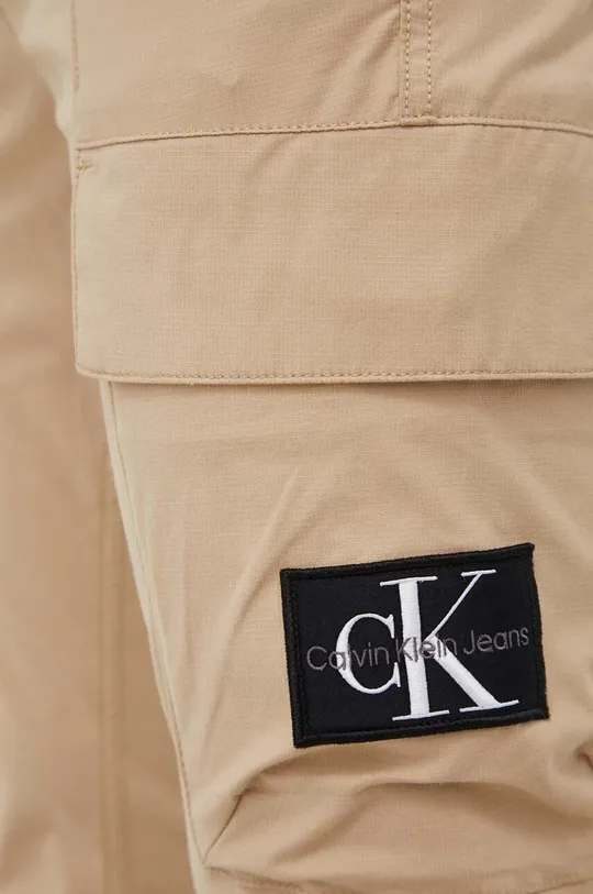 beżowy Calvin Klein Jeans spodnie