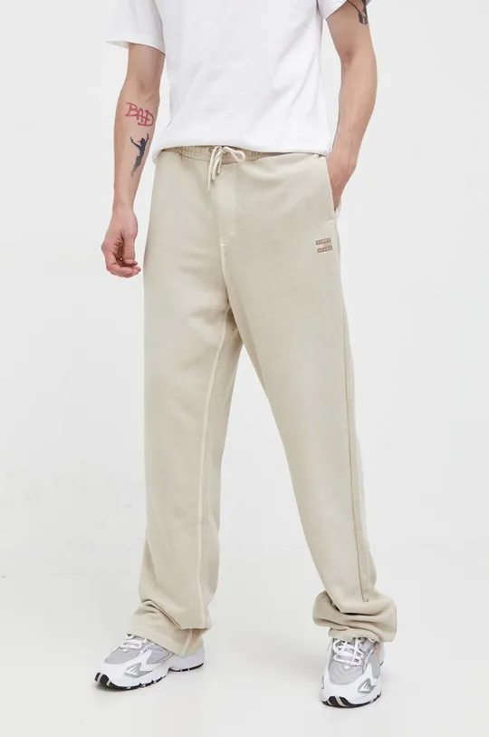beżowy Tommy Jeans spodnie dresowe bawełniane Męski