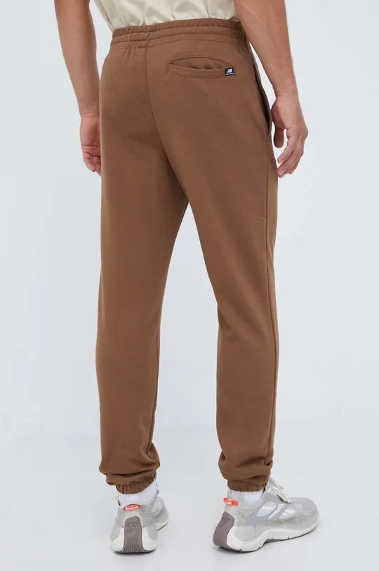 New Balance spodnie dresowe 60 % Bawełna, 40 % Poliester