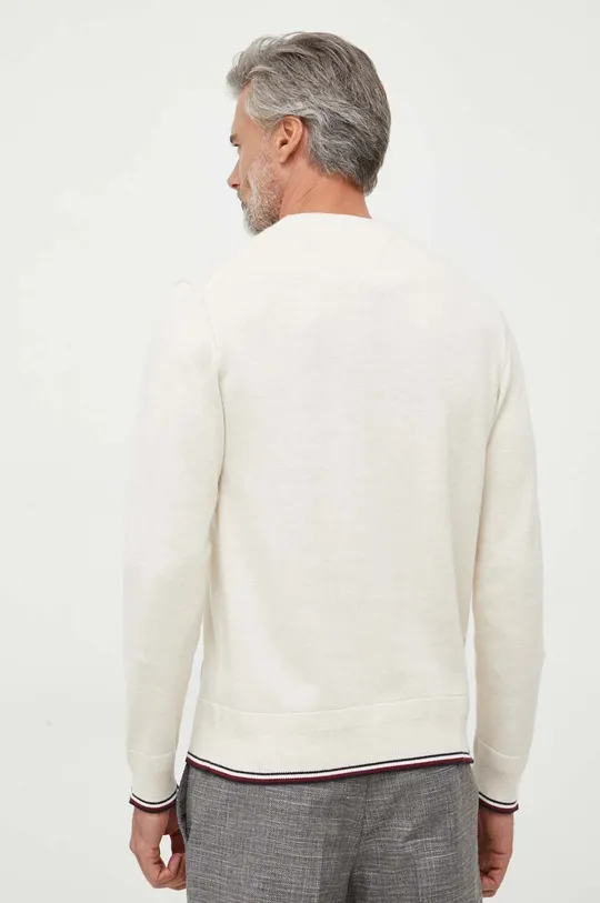 Ένα πουλόβερ σε μείγμα μεταξιού Tommy Hilfiger  70% Βαμβάκι, 22% Πολυαμίδη, 8% Μετάξι