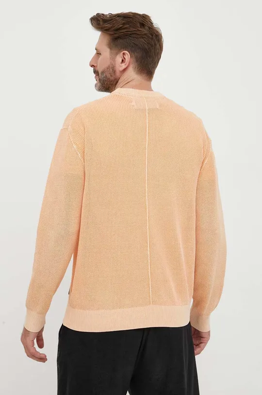 Bombažen pulover Calvin Klein Jeans oranžna