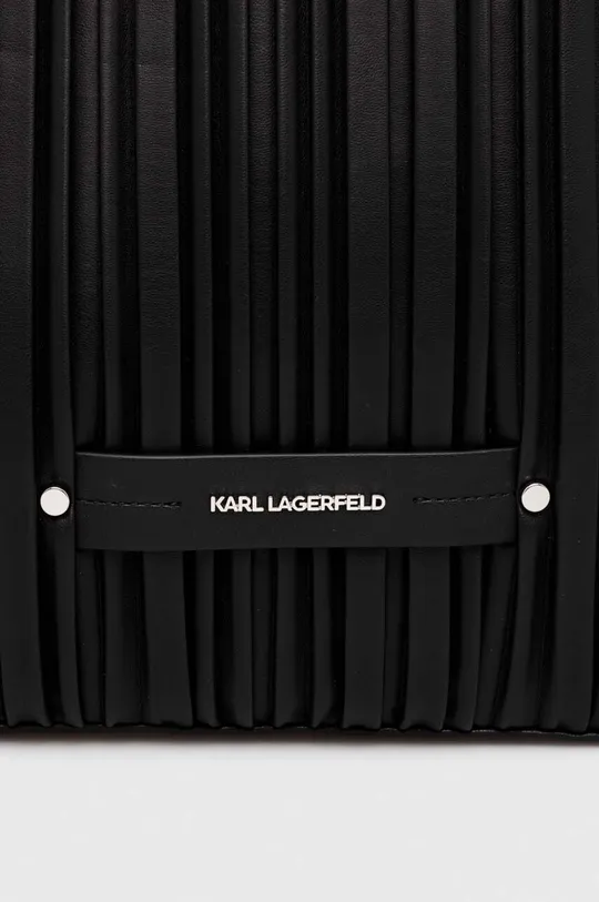 Сумочка Karl Lagerfeld Основний матеріал: 58% Перероблений поліуретан, 42% Поліуретан Підкладка: 100% Перероблений поліестер