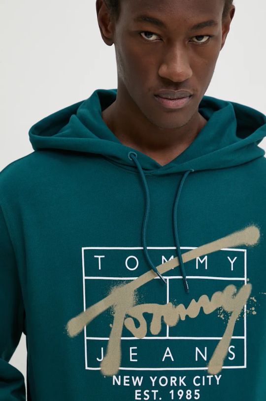 Bombažen pulover Tommy Jeans turkizna DM0DM20593