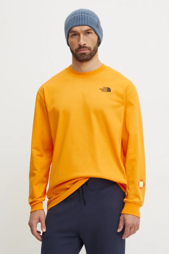 The North Face longsleeve bawełniany TNF x Yinka Ilori NF0A89CA1IW1 pomarańczowy