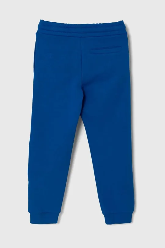 Guess spodnie dresowe bawełniane dziecięce niebieski