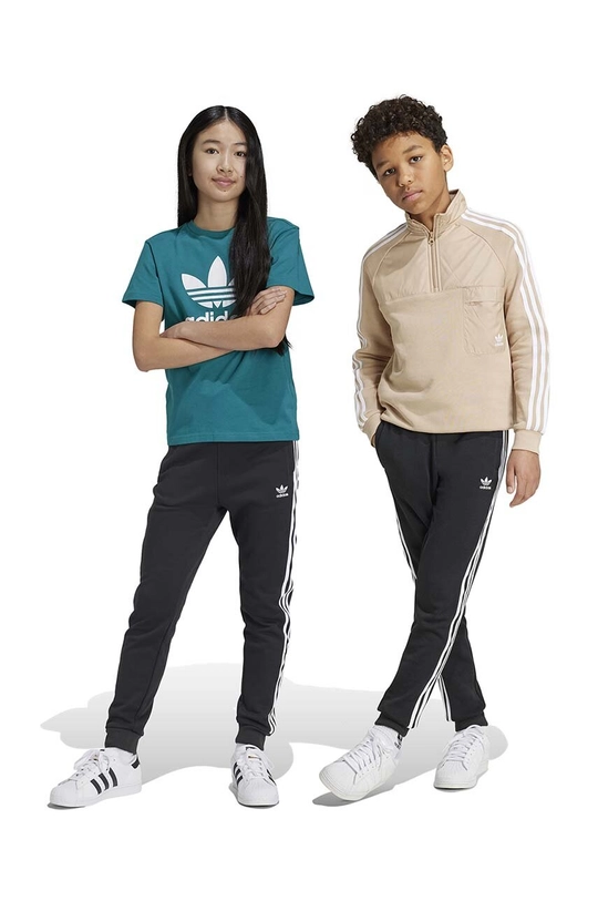 Dječji donji dio trenirke adidas Originals TREFOIL PANTS natpis crna IY7484