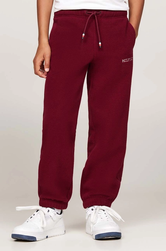 Chłopiec Tommy Hilfiger spodnie dresowe dziecięce U POLAR FLEECE SWEATPANTS KS0KS00583.9BYH. bordowy