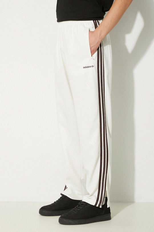 Odzież adidas Originals spodnie dresowe 80s Premium Embossed 3 Stripes Track Pant JC6532 beżowy