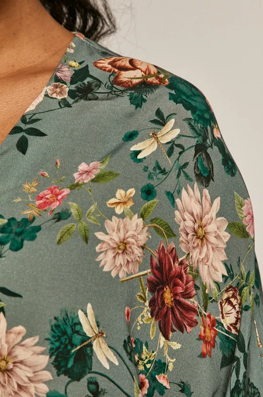 Bluzka damska w kwiaty ze spiczastym dekoltem turkusowa Damski