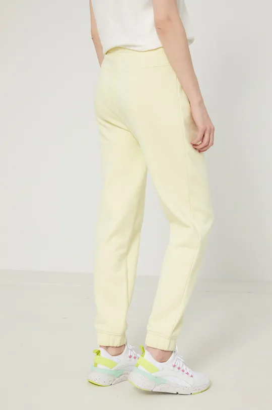 Spodnie dresowe damskie ze ściągaczem żółte 70 % Bawełna, 30 % Poliester