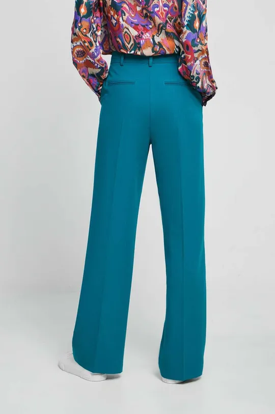 Kalhoty dámské tyrkysová barva  Hlavní materiál: 74 % Polyester, 21 % Viskóza, 5 % Elastan Jiné materiály: 100 % Polyester