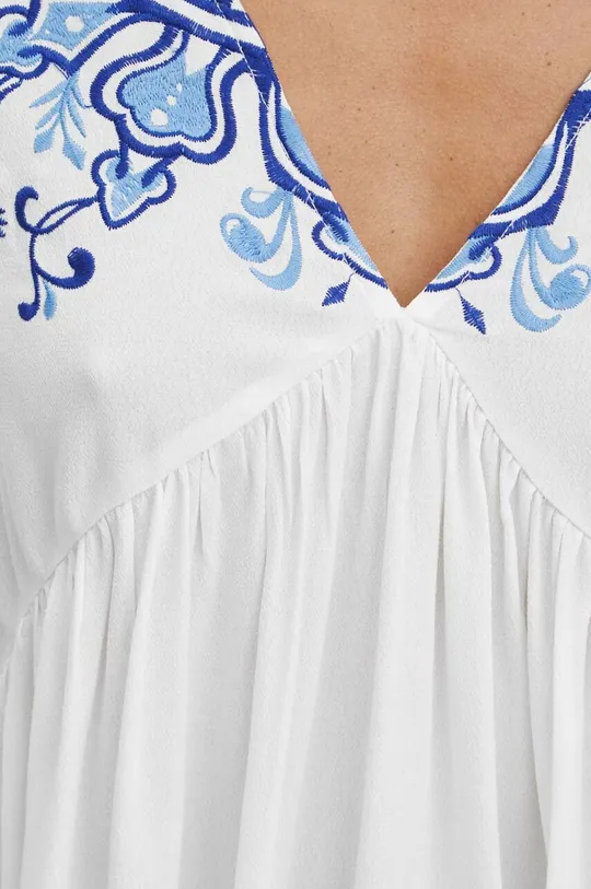 Bluzka damska oversize z ozdobnym haftem kolor kremowy Damski