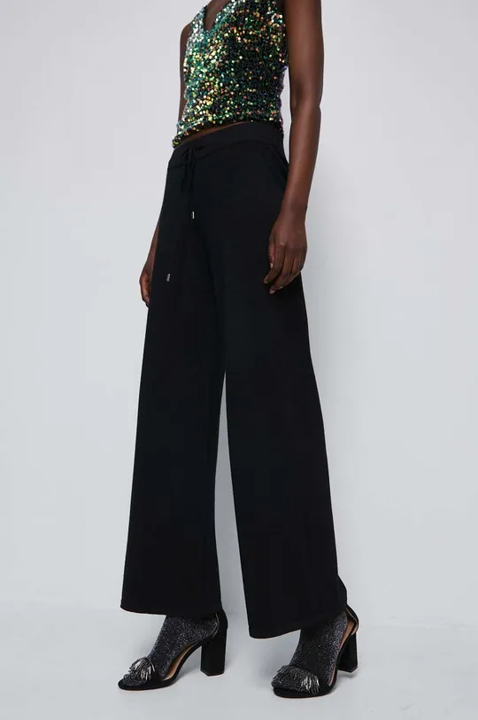 czarny Spodnie damskie z włóknem metalicznym kolor czarny Damski