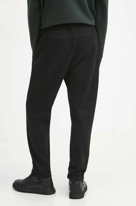 Spodnie dresowe męskie gładkie kolor czarny Materiał główny: 84 % Bawełna, 16 % Poliamid Materiał dodatkowy: 100 % Bawełna