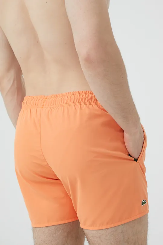 Plavkové šortky Lacoste oranžová