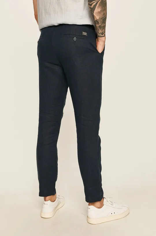 Guess Jeans - Nohavice  Podšívka: 40% Bavlna, 60% Polyester Základná látka: 100% Ľan