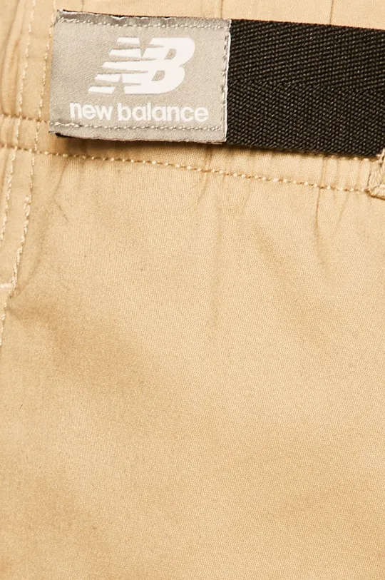 beżowy New Balance - Spodnie MP01504INC