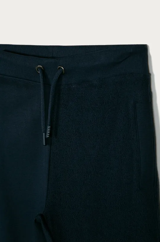 tmavomodrá Guess - Detské nohavice 129-175 cm