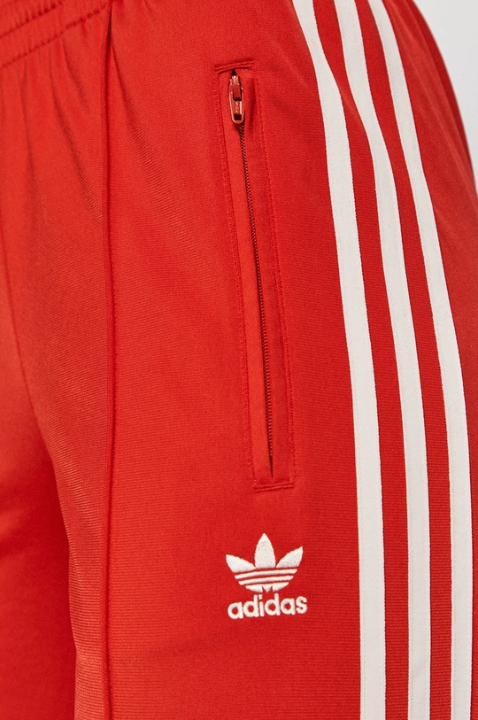 червоний adidas Originals - Штани GN2820