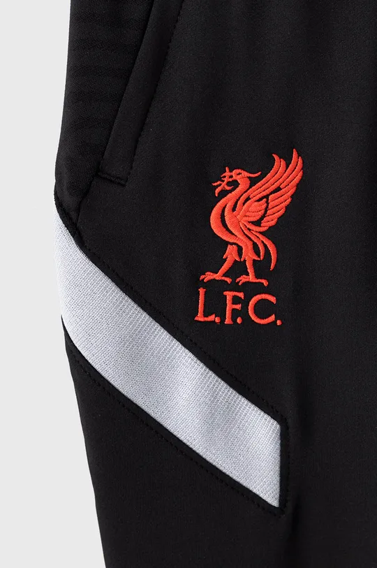 Детские брюки Nike Kids x Liverpool FC 122-170 cm  Материал 1: 9% Эластан, 91% Полиэстер Материал 2: 5% Эластан, 95% Полиэстер Подкладка кармана: 100% Полиэстер