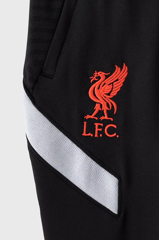 Detské nohavice Nike Kids x Liverpool FC 122-170 cm  1. látka: 9% Elastan, 91% Polyester 2. látka: 5% Elastan, 95% Polyester Podšívka vrecka: 100% Polyester