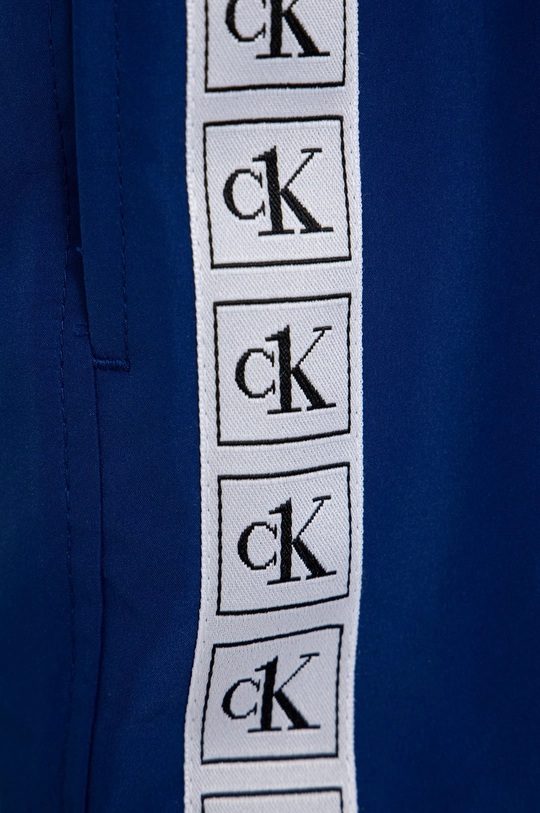 Otroške kopalne kratke hlače Calvin Klein Jeans  Glavni material: 100% Poliester Podloga: 100% Poliester