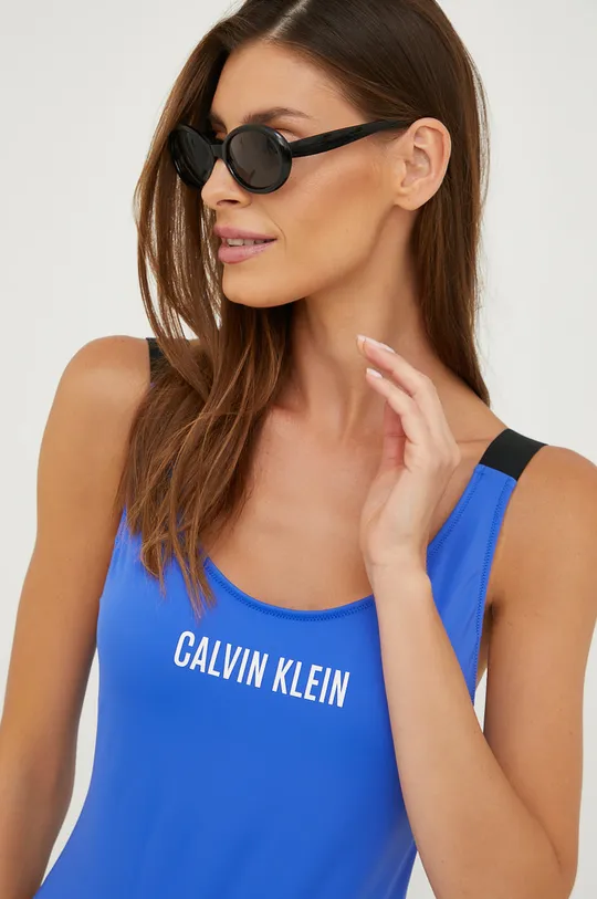 Μαγιό Calvin Klein  Κύριο υλικό: 78% Πολυαμίδη, 22% Σπαντέξ Φόδρα: 92% Πολυεστέρας, 8% Σπαντέξ