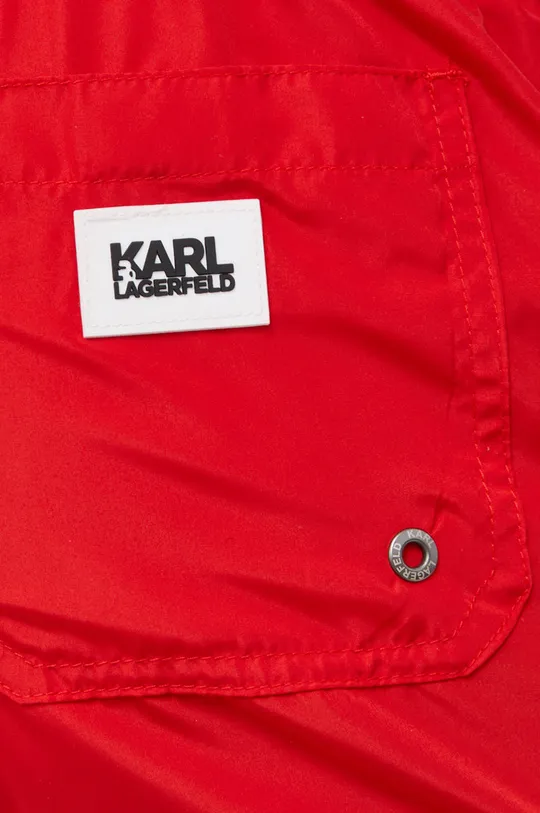 Σορτς κολύμβησης Karl Lagerfeld  Κύριο υλικό: 100% Πολυεστέρας Φόδρα: 93% Πολυαμίδη, 7% Σπαντέξ