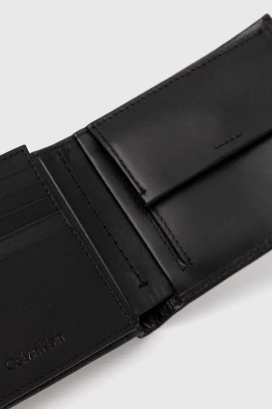Шкіряний гаманець Calvin Klein  Основний матеріал: 100% Натуральна шкіра Підкладка: 100% Перероблений поліестер