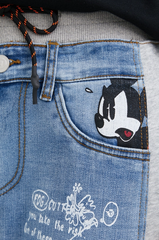 Desigual jeansy x Disney 22SWDD50 70 % Bawełna, 2 % Elastan, 28 % Poliester, Wskazówki pielęgnacyjne:  prać w pralce w temperaturze 30 stopni, nie suszyć w suszarce bębnowej, nie wybielać, prasować w średniej temperaturze