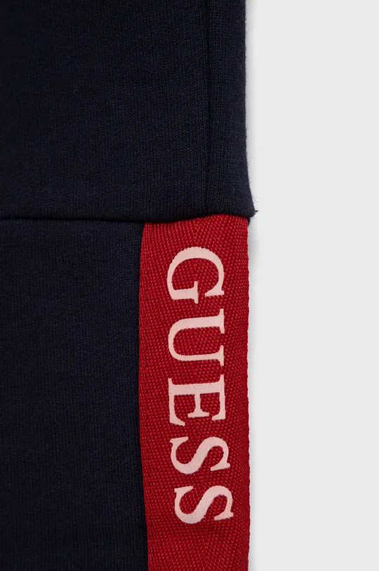 Guess - Spodnie bawełniane dziecięce 100 % Bawełna