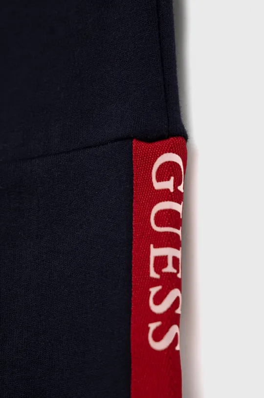 Guess - Spodnie bawełniane dziecięce 100 % Bawełna