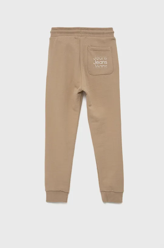 Detské bavlnené nohavice Calvin Klein Jeans béžová