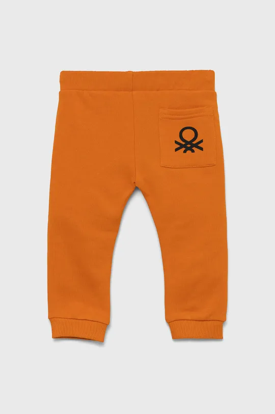 Detské bavlnené nohavice United Colors of Benetton oranžová