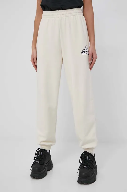 beżowy adidas spodnie bawełniane HC9175 Damski