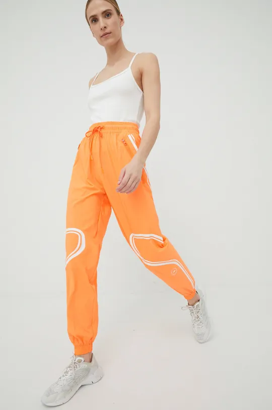 Παντελόνι προπόνησης adidas by Stella McCartney Truepace πορτοκαλί