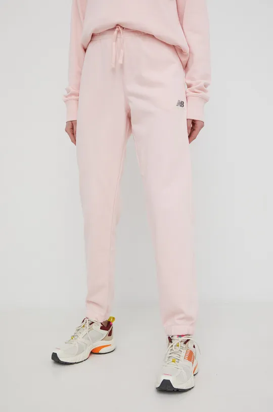 różowy New Balance spodnie dresowe UP21500PIE Damski