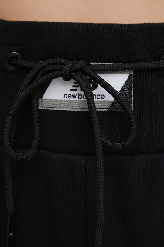 czarny New Balance spodnie dresowe bawełniane WP21503BK