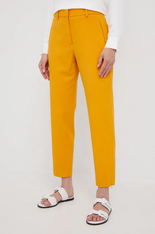 Calvin Klein spodnie z domieszką wełny pomarańczowy
