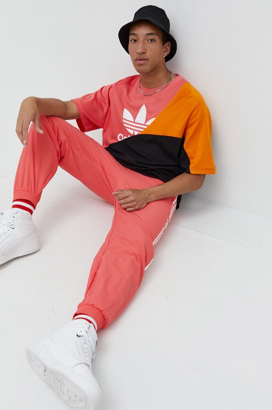 oranžová Tepláky adidas Originals Adicolor